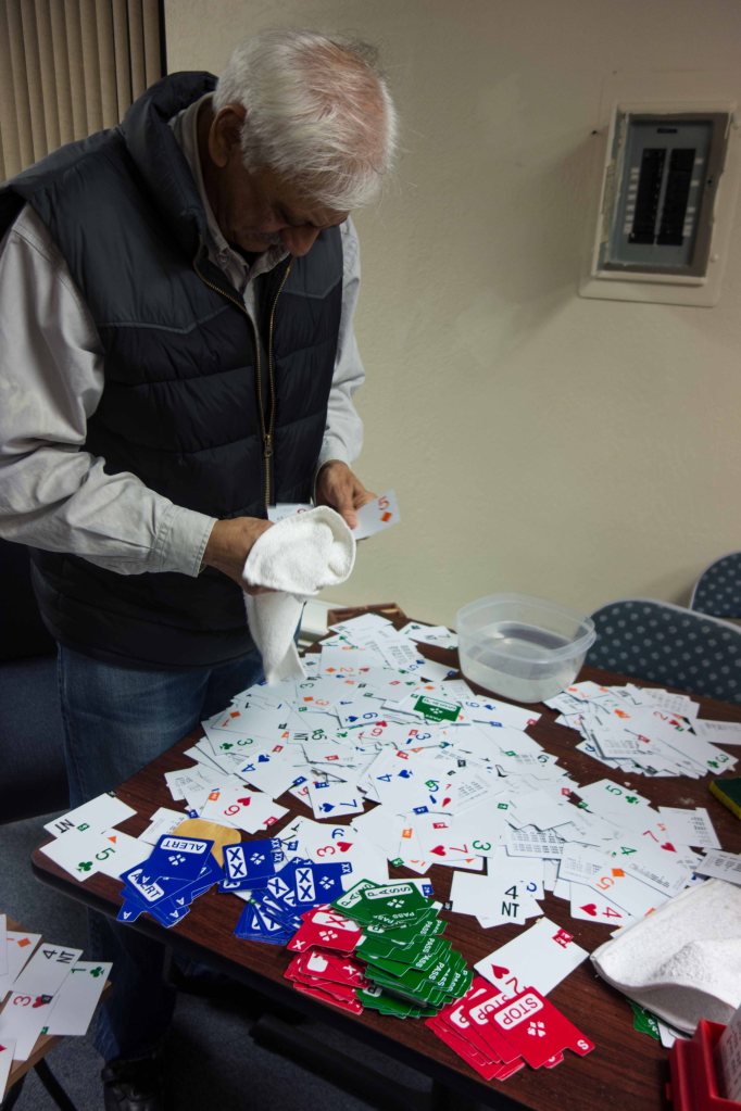 Ravi Bhalla sorts hundreds of jumbled bidding cards