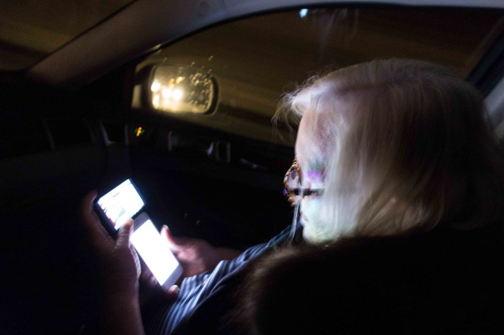 Non-techy Gail using two iPhones at once in the car.