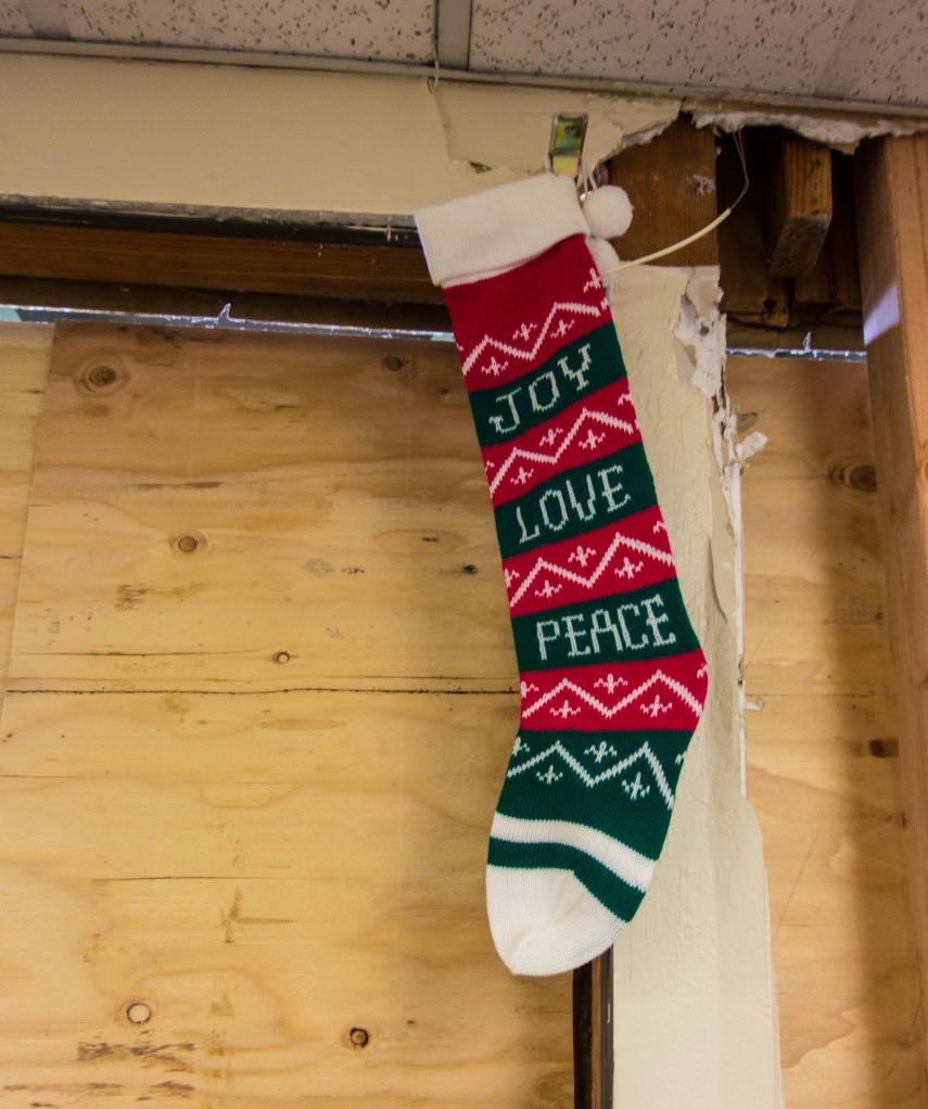 The stocking was hung by the damage with care