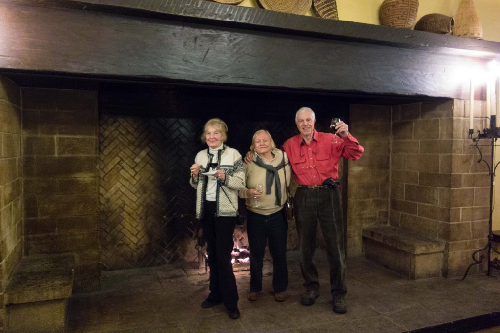 Jeannie, Gail and Bill inside one of the mammoth fireplaces.