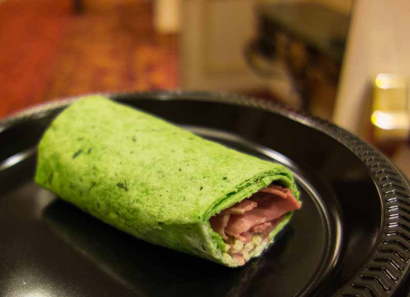 Spinach tortilla wrap with corned beef and cabbage