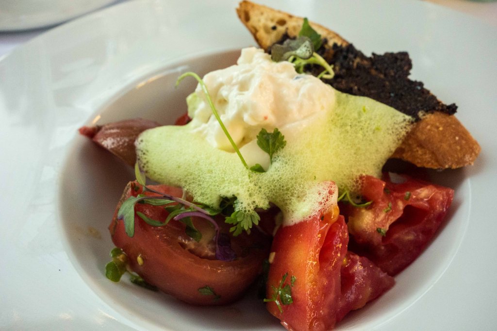 - Marinated Heirloom Tomatoes, Burrata Cheese, Oil Cured Tapenade, Fines Herb Emulsion