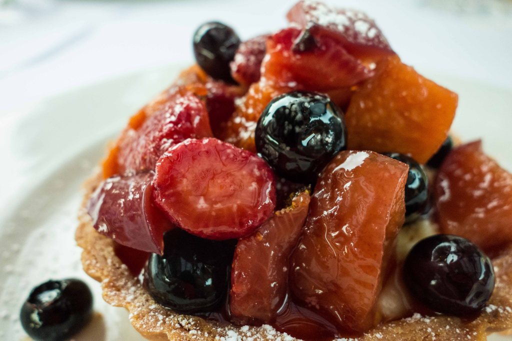 Stone fruit tart on vanilla custard