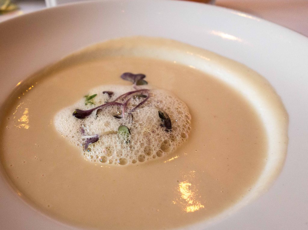 Cauliflower soup with anchovy foam and purple daikon radish