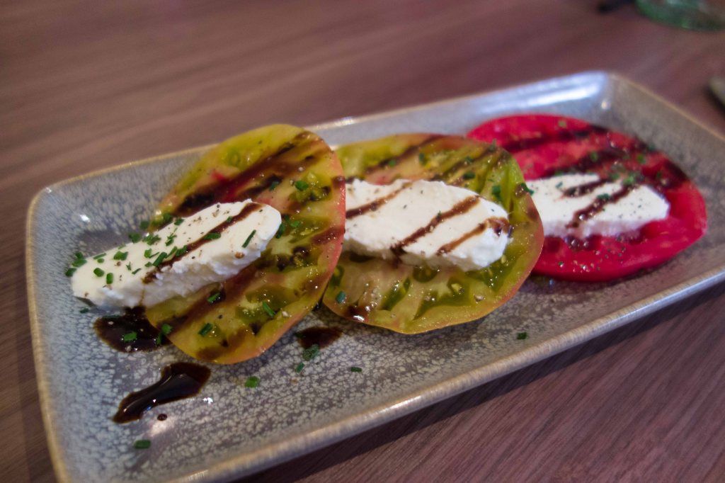 Heirloom tomatoes, mozzarella and not enough basil.