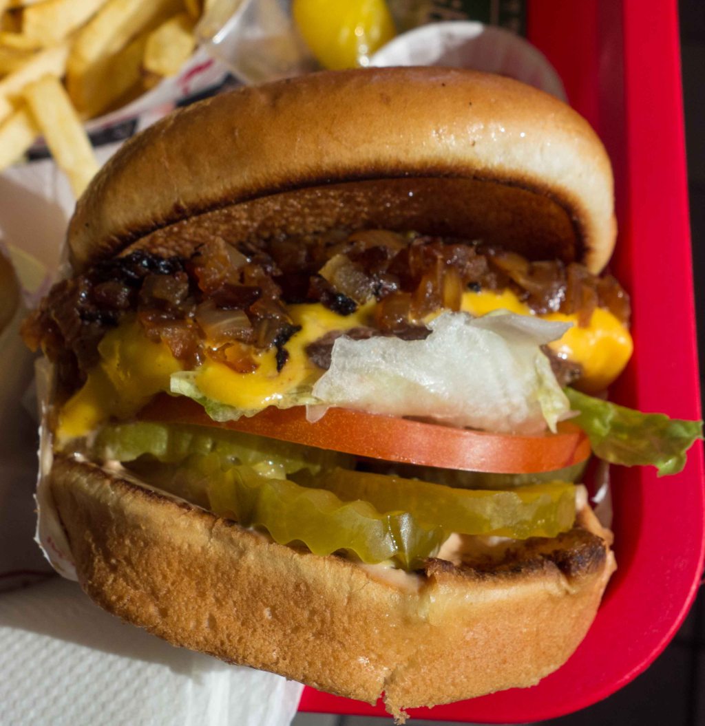 Meat cooked in mustard and topped with grilled onions.