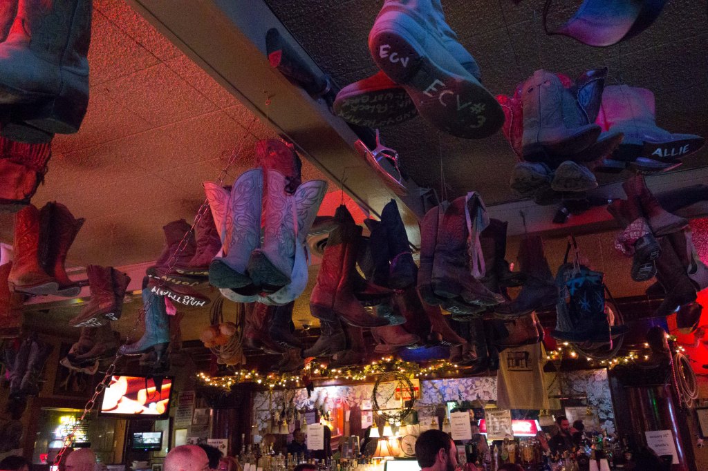Boots hanging from the ceiling.