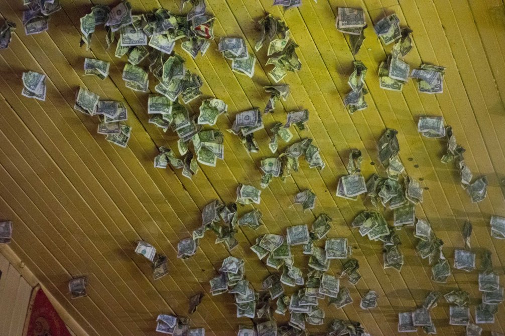 The entire ceiling is covered with money.  How do we get people to do this at our house?