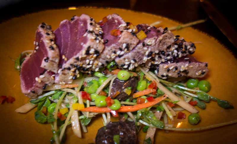 A very Asian salad topped with seared Ahi