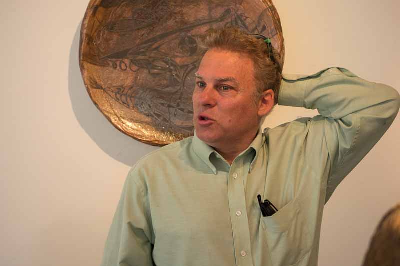 John Natsoulas, fountain of energy, talking about the art in his gallery.