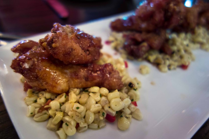 Very sweet and crispy wings, on fresh corn.