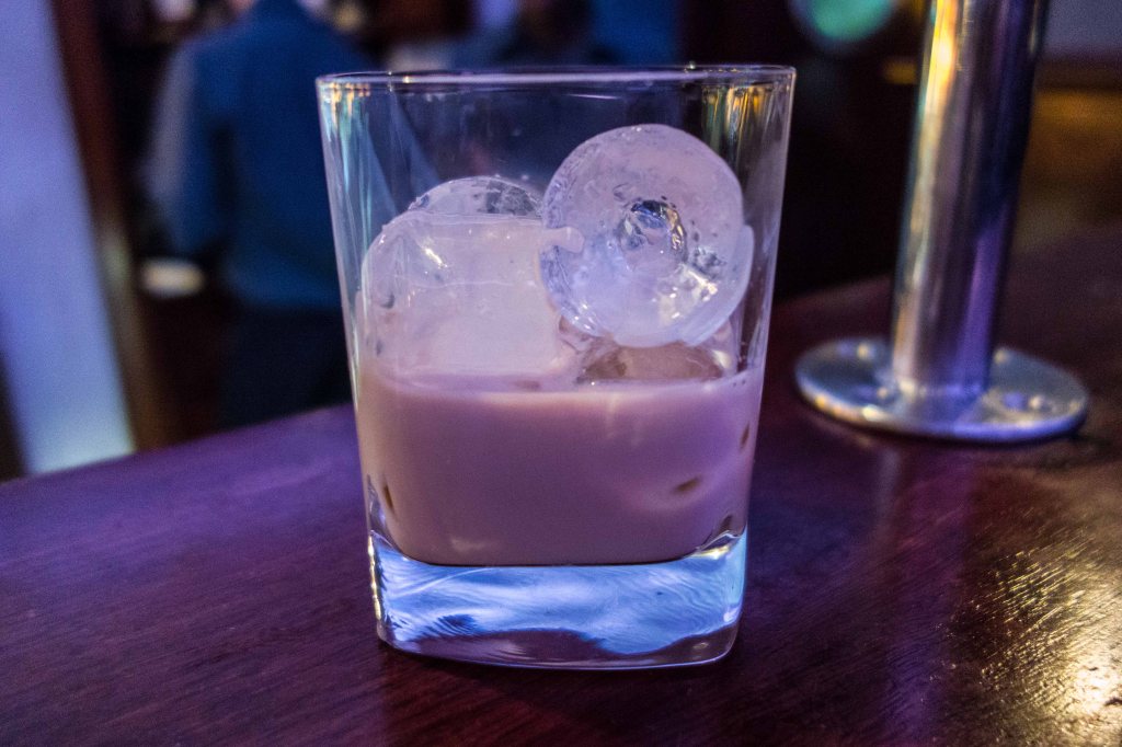 A double.  Really and truly--I made the barman show me the shot glass and I measured the booze back into it.