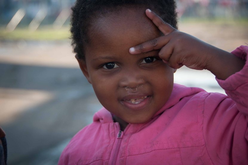 The strange little finger sign is just because she's 3.