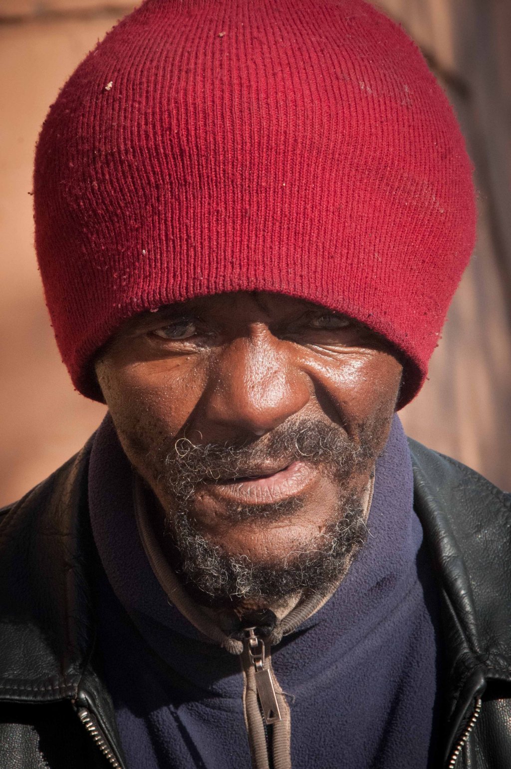 Mother would have said his face look like 40 miles of bad road.