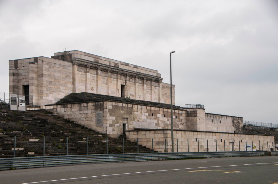 Now in a state of major disrepair, the platform from which Hitler spoke is still visible.