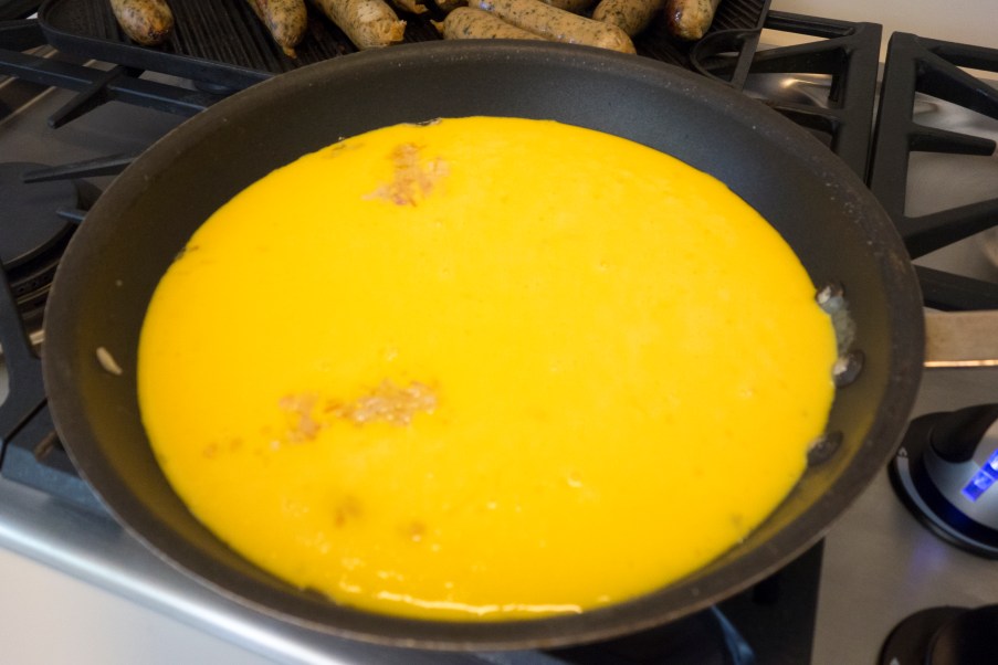 That's a big frying pan very full of egg.