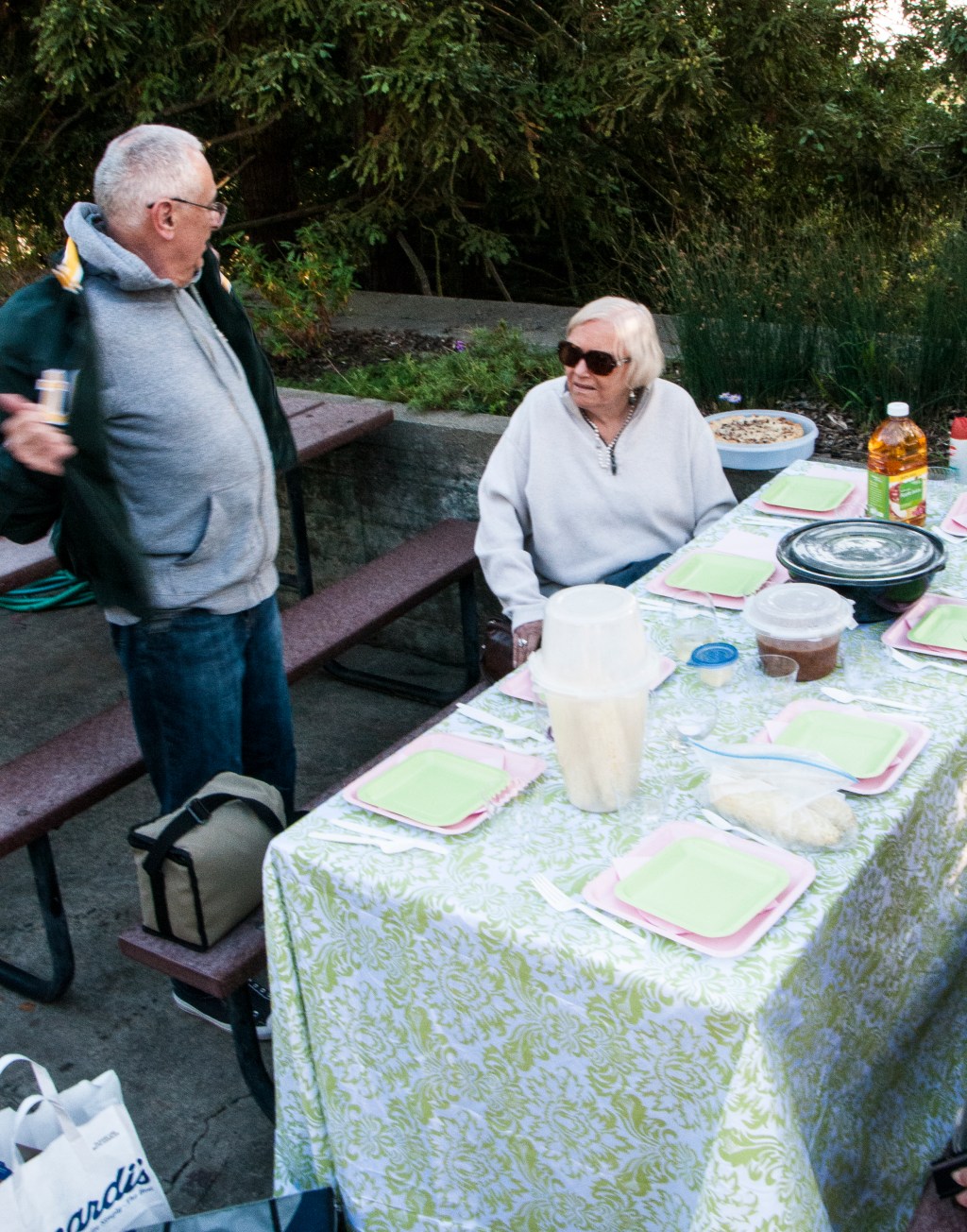 Gail and Ed.  Colorful table setting by Linda Friedman