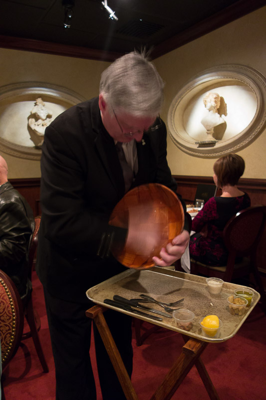 Our waiter assiduously rubbing the bowl with garlic.