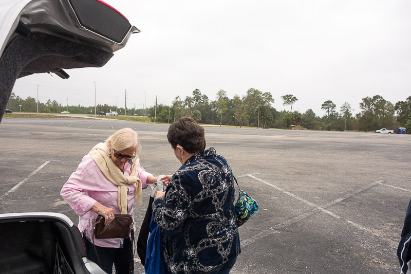 In the parking lot, getting out coats and hats.  Notice the vast emptiness behind the girls--no problem finding a parking space.