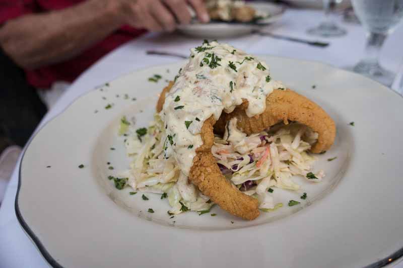 Corn Fried Louisiana Catfish - Served with jumbo lump crabmeat Napa slaw and green onion & cayenne tartar sauce