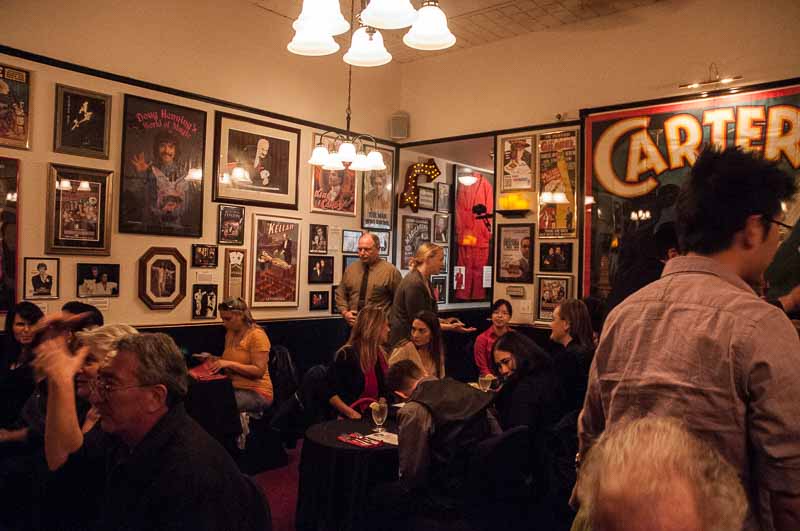 The walls are covered with a King's ransom in antique show posters.