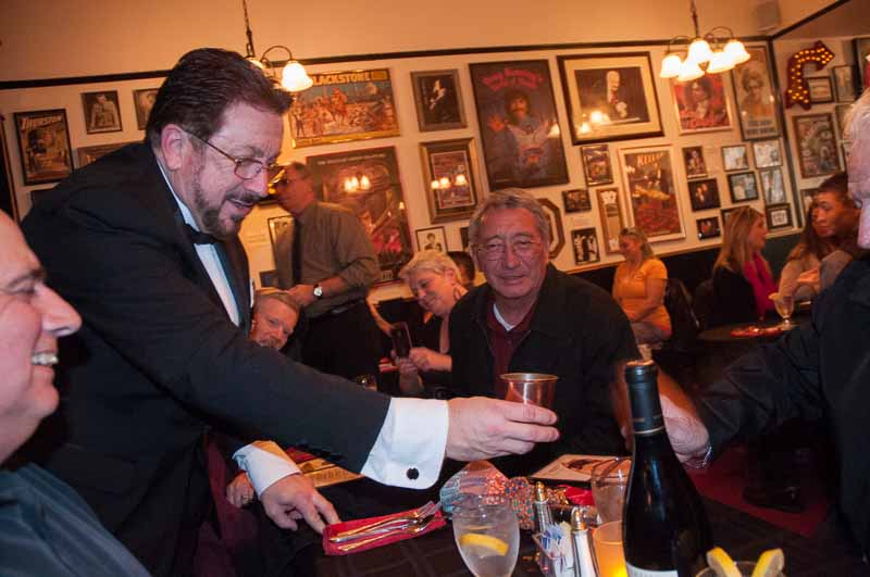 The owner of the club performing at our table before the show.