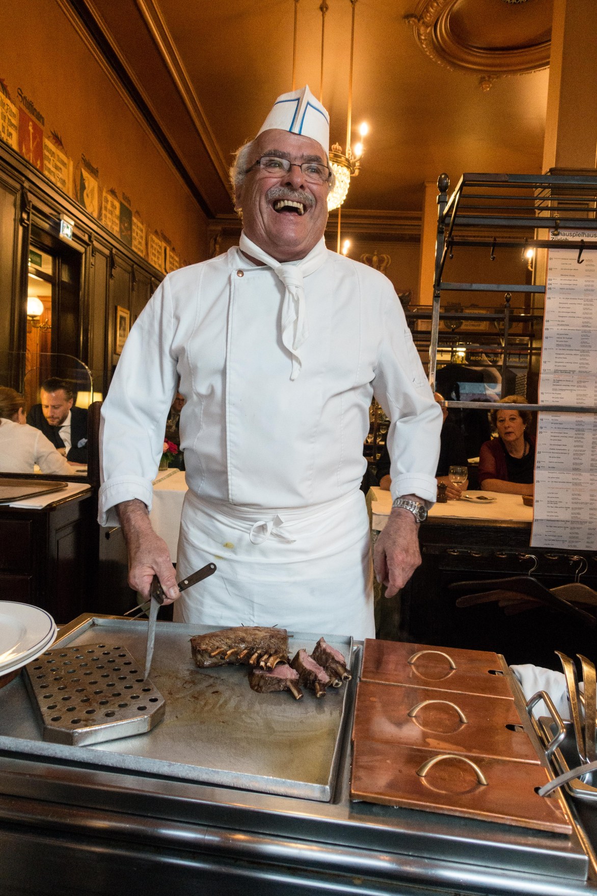 Is he from central casting or the culinary academy?  And who cares?