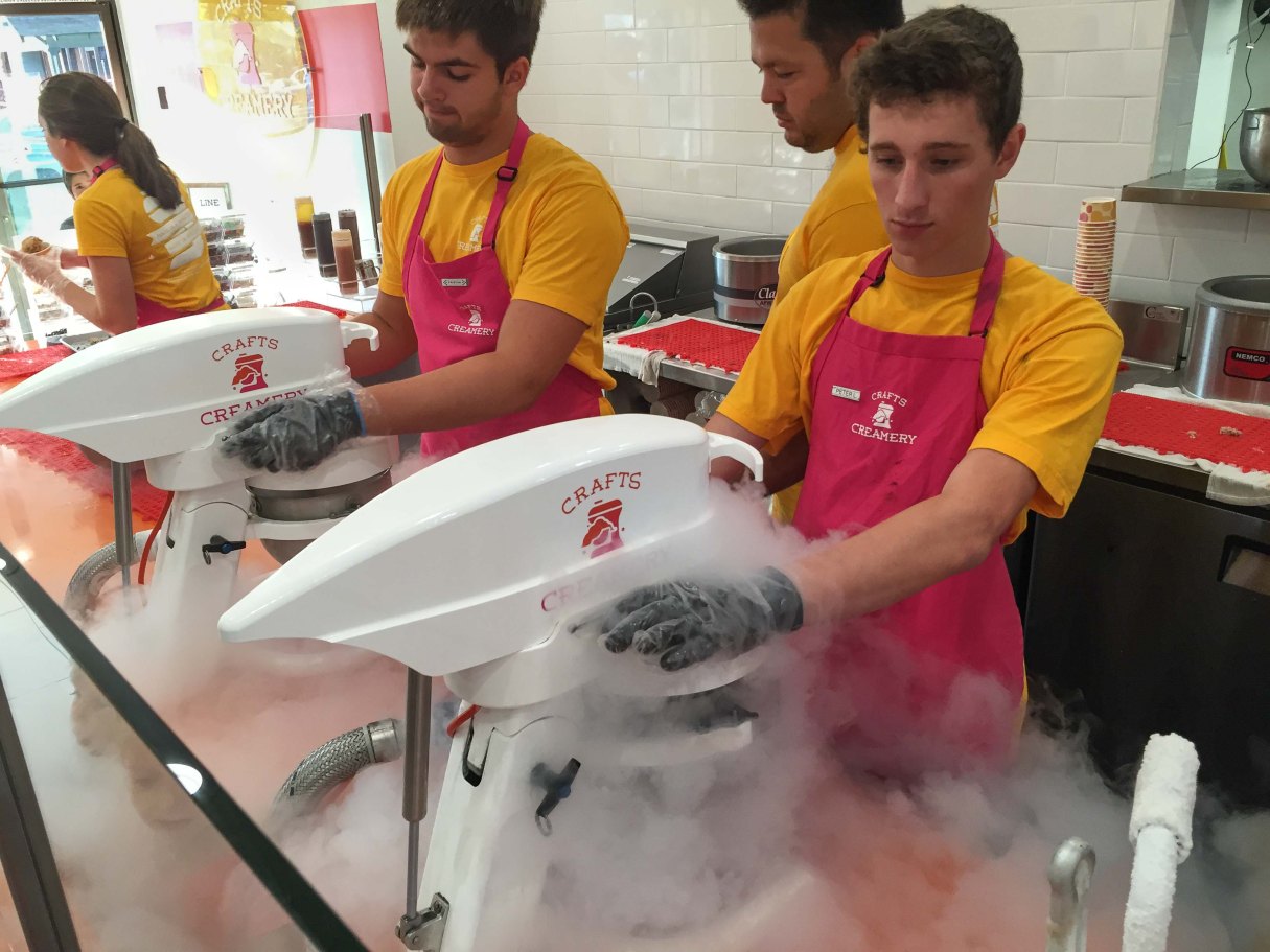 A row of mixer/freezers churning out individual servings