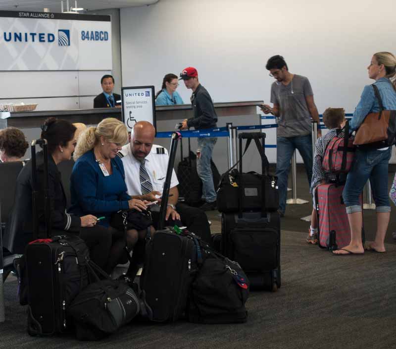 United flight crew taking all the seats in the handicap section