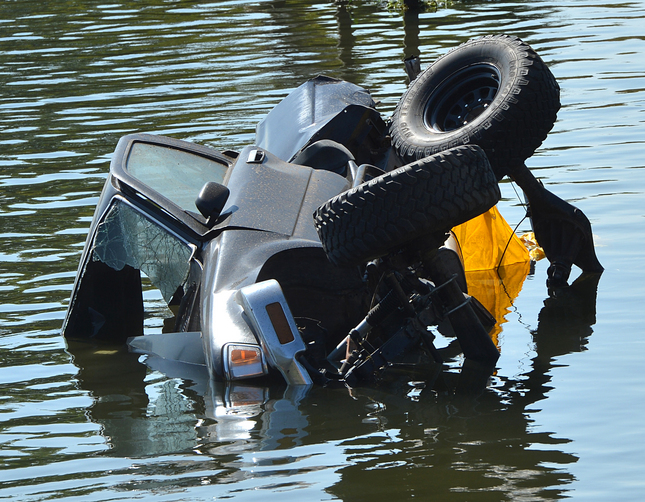 A mangled truck that lay in the water off to the left of the railroad track where an Amtrak train collided  with the truck and trailer carrying a jet ski with it off Orwood Road in Byron, Calif., on Thursday, Aug. 20, 2015. A woman floating in the water was hit by the truck and the woman and the driver of the truck were taken by helicopter with unknown injuries. (Dan Rosenstrauch/Bay Area News Group)