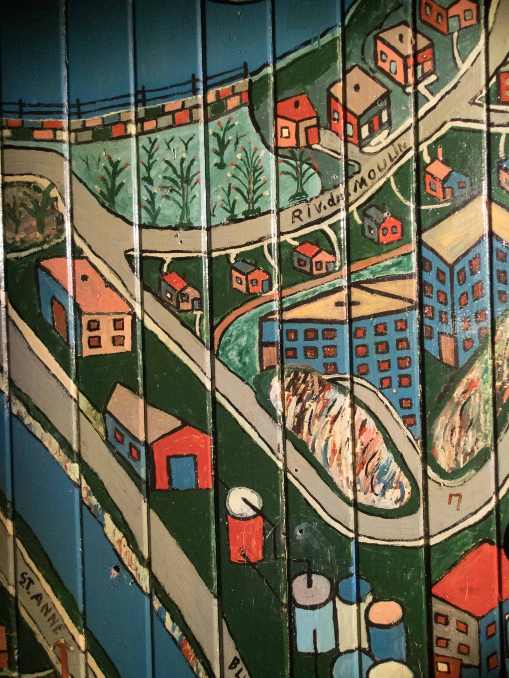 Part of the front wall of the house, coated in shellac to protect it from the elements.