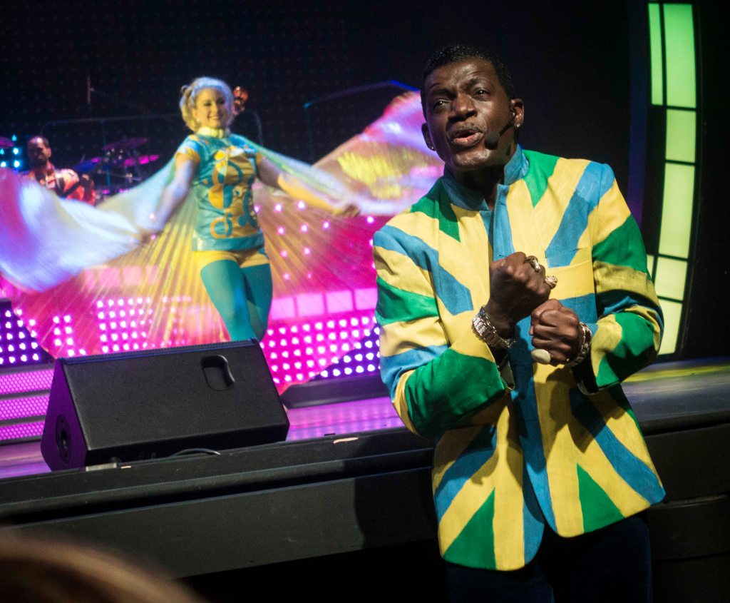 Coming out into the audience to bring the music to the crowd.