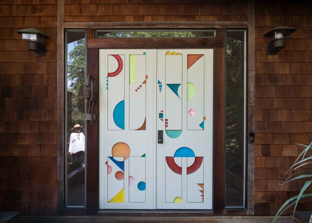 Sculptured front doors by Stan Dann.