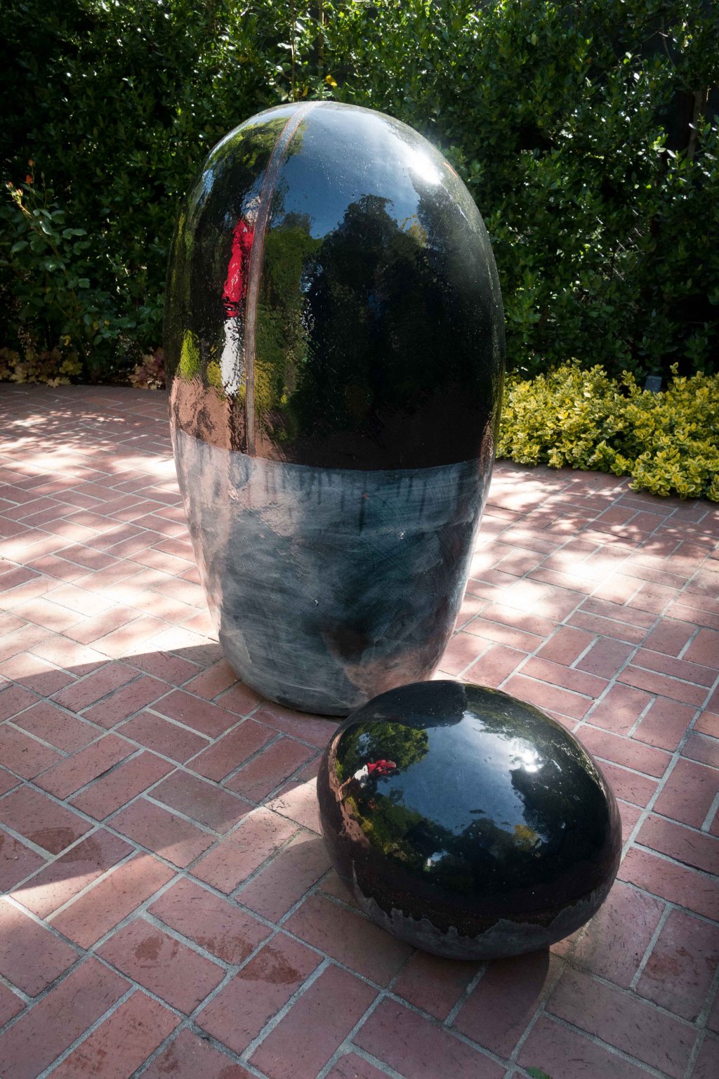 The red is the reflection of a lady's coat.